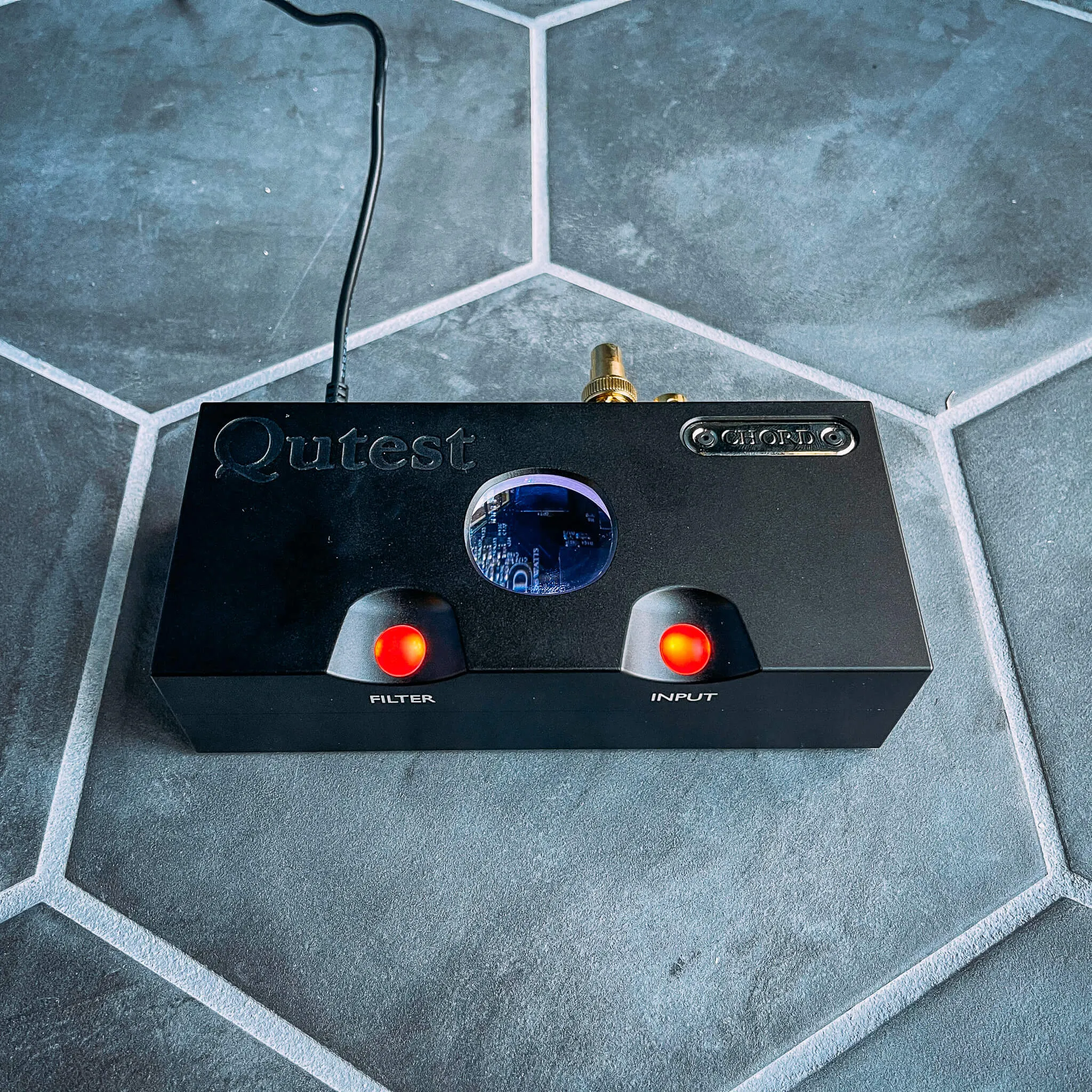 Shot of Chord Qutest on with colored pebble lights and portal in top